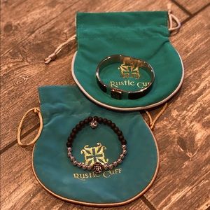 2 black, silver and gold RC bracelets.